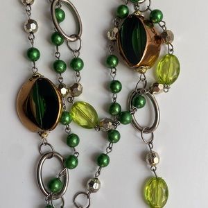 EUC costume jewelry necklace , 3 strands connected into one.  About 11” long on.